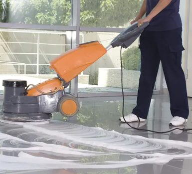 Group 1321314578 Commercial floor cleaning in progress using a professional cleaning machine.